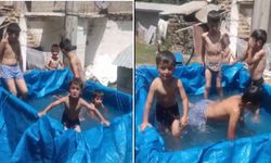 Köy çocuklarının ilginç serinleme yöntemi