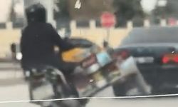 Tüp yüklü motosikletle trafikte tehlikeli hareketler